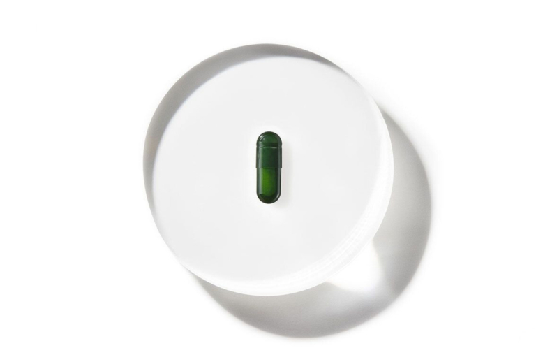 Med-Lock ds-01 capsule on top of magnified glass