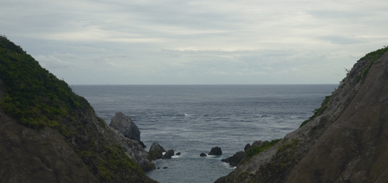 Coastal mountain landscape with cloudy skies
