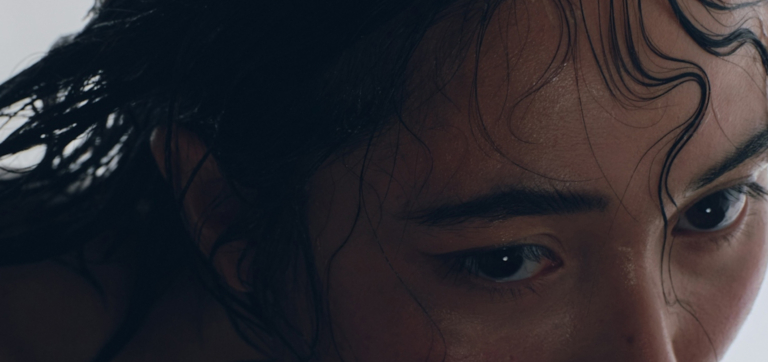 person sweating from forehead