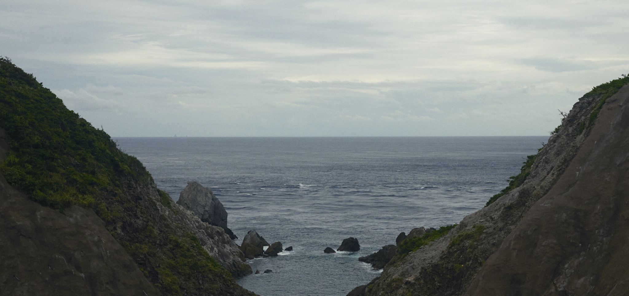 Coastal mountain landscape with cloudy skies