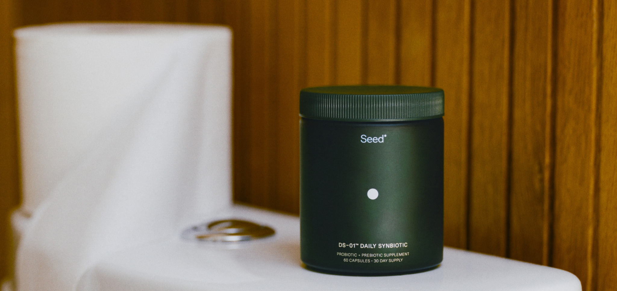 Dark green container of Med-Lock DS-01 Daily Synbiotic probiotic supplement on white surface